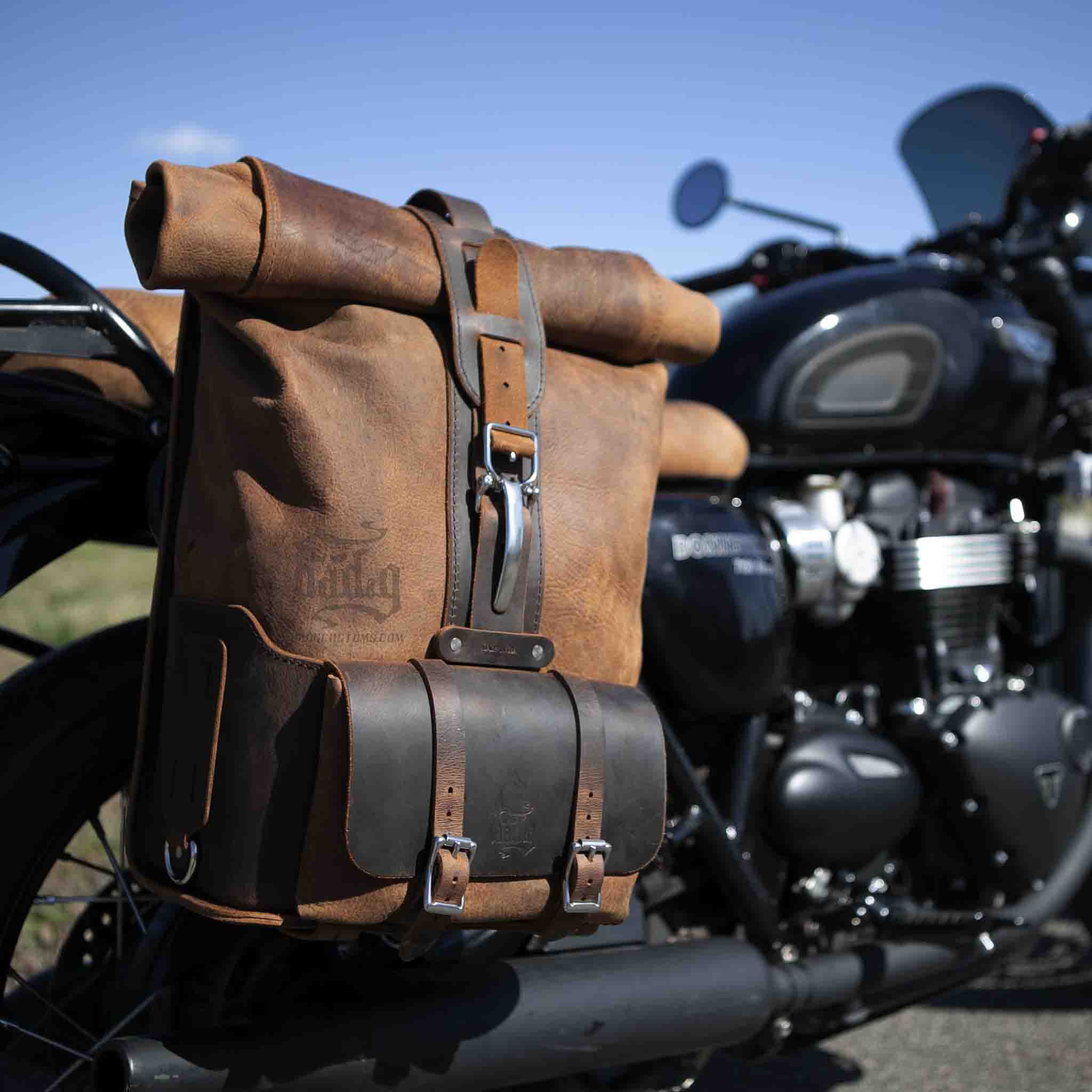 Upgrade your ride with the URB01 Rolltop Backpack Saddlebag. Unique design enables quick conversion from saddlebag to backpack. Hand crafted in USA with premium veg tan water buffalo leather and stainless steel hardware. Durable and stylish, it's the perfect fit for your motorcycle.